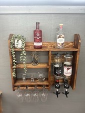 Wall mounted optics bar