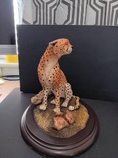 Feathers of Knysna, South Africa: Limited Edition Handcrafted Seated Cheetah
