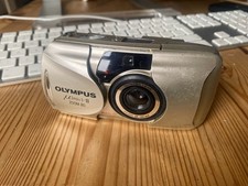 Olympus mju ii zoom 80 All weather. Plus battery. Lens cover needs fixing.