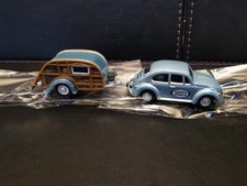 Blue VW Beetle with Caravan
