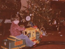Boy Riding Toy Train Indoor