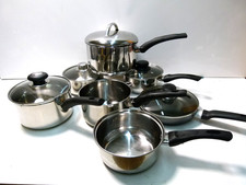 6 STAINLESS STEEL PANS + 1 FRYING PAN WITH LID.