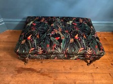 Victorian ottoman with brass castors.