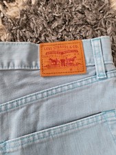 Levi's ladies blue denim mini skirt size 31 Red Tab button fly with frayed edges