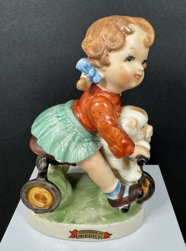 Vintage small girl riding - small,