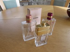 Three empty chanel perfume bottles and empty chanel perfume box coco allure