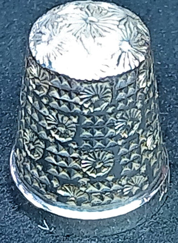 Size silver thimble by - 16,