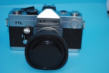 Petri TTL 35mm Camera with 55mm lens and UV filter.