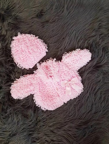 Hand knitted baby - hand,