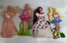 Barbie Dolls . Four Figurines.  McDonald's Toys .  Approx 20-25 Years Old.
