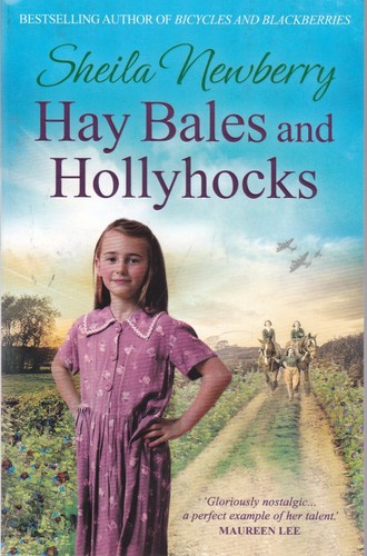 Hay bales and - and, hollyhocks