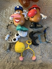 2 Potato Head Figurines And
