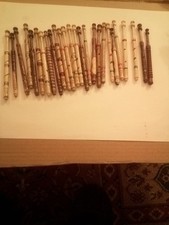 Twenty six various decorated wooden lace bobbins. Unused.