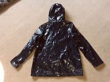 PVC PU glossy vinyl mac. Shiny and tactile. Large attached hood. Zip front. Sz18