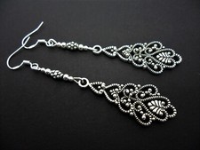 A PAIR OF TIBETAN SILVER LONG