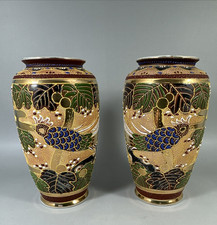 A Pair of Japanese Moriage Vases, hand painted and gilded .