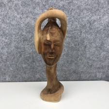 Hand-Carved Wooden Sculpture Of A Human Bust With A Stylised Looping Hairstyle