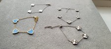 4 bracelets featuring cloverleafs and hearts - Worn and New