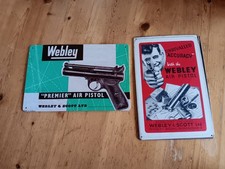 Webley tin signs one of - (one,