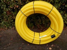 A 50 METRE COIL OF PERFORATED DRAINAGE PIPE