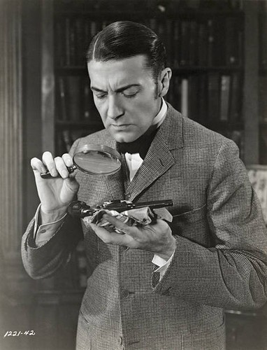 Clive brooks examining gun - a,
