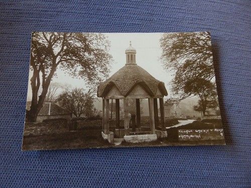 Postcard village green - green, pump