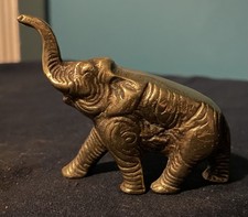 A vintage cast brass elephant