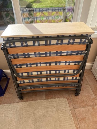 Compact folding bed with - bed,