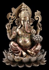 Ganesha Figurine On Lotus