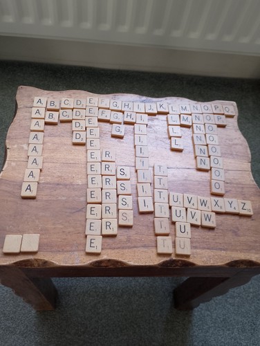 Wooden scrabble tiles in - scrabble,