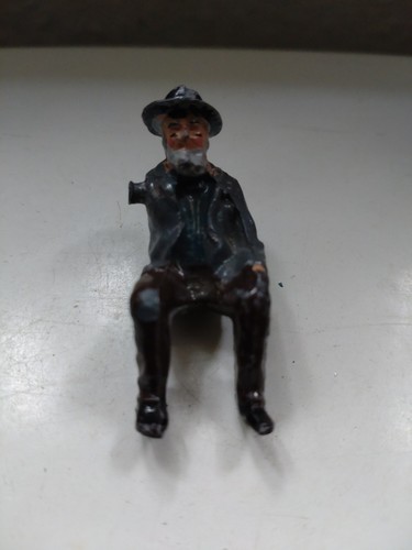 Seated bearded man wearing hat - seated,