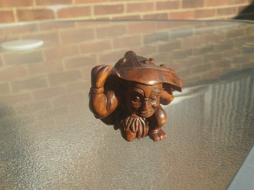 Hand carved wood netsuke oni - hand,