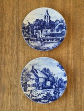 Two original blauw delft wall hung plates 23 cm diameter