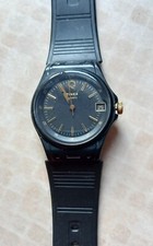 Vintage Q Timex quartz. Black face with gold raised markers