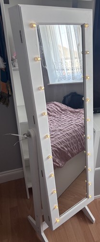 Jewellery storage mirror with