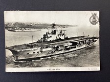 A postcard of the aircraft carrier HMS Ark Royal entering Portsmouth c1950s.