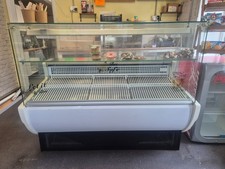 White Tavira serve over counter fridge. Will need dismantling to move