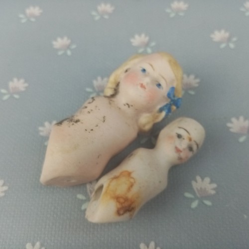 Pair antique bisque - of,