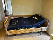 Opera Signature Profiling Bed with mattress and overbed table