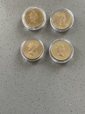 A COLLECTION OF FOUR OLD  BRASS VINTAGE ENGLISH £2 COINS (1989-1995-1994-1995)
