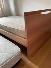 Trundle  bed. Wooden Bed Frame with guest bed and mattresses