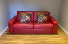 Sofabed 3 seater faux leather in red; excellent condition from Furniture Village