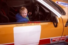 PHOTO  ANDY HEAT AGED 3 AT THE WHEEL OF RUSSELL BROOKES' ANDREWS HEAT FOR HIRE F