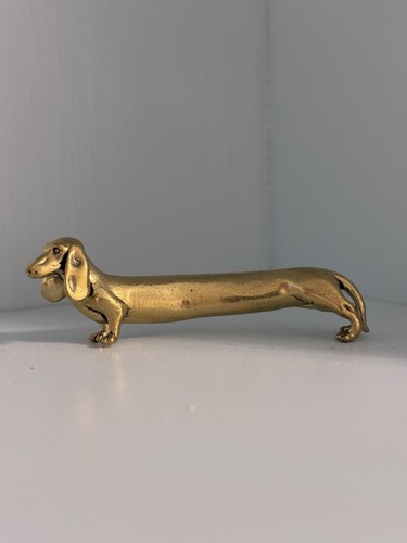 Long slightly curving brass - slightly,
