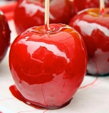 8 Toffee Apples Freshly Coated In Traditional Red Toffee.