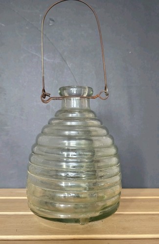 Beehive shaped glass flying - glass,