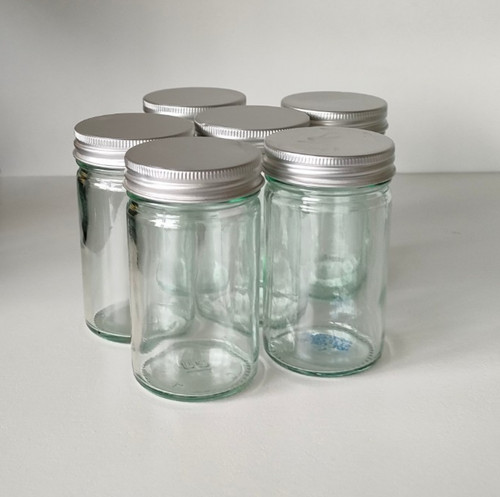 Six small clear - glass, jars