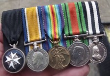 A PERIOD MINIATURE WW1 PAIR