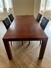 Dark solid wood dining table