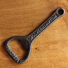 VINTAGE CAST IRON BOTTLE